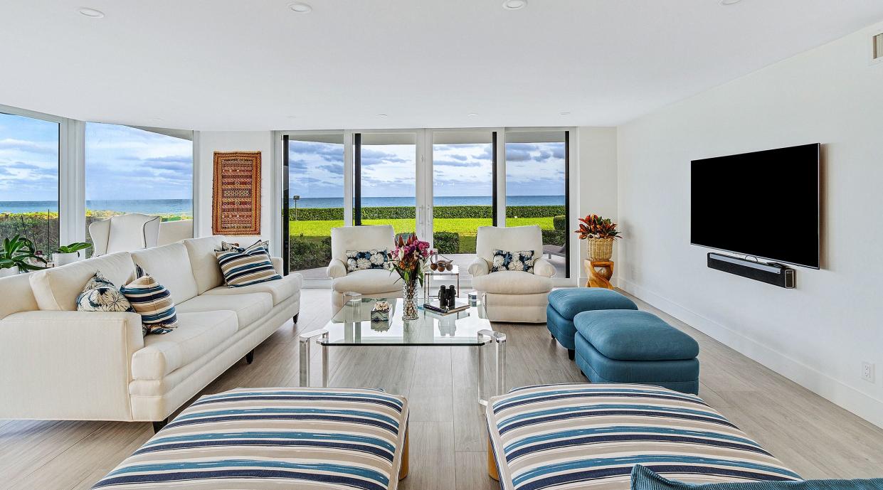 Floors in the main living area are covered in porcelain tiles with a pattern that recalls the look of wood planks.