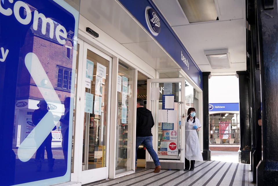 A general view of Boots operating a one in one out system for the pharmacy use only in Lichfield, the day after Prime Minister Boris Johnson called on people to stay at home and avoid all non-essential contacts and travel in order to reduce the impact of the coronavirus pandemic.