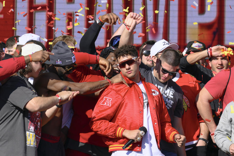 Kansas City Chiefs quarterback Patrick Mahomes is mobbed by his teammates during their victory rally in Kansas City, Mo., Wednesday, Feb. 14, 2024. The Chiefs defeated the San Francisco 49ers Sunday in the NFL Super Bowl 58 football game. (AP Photo/Reed Hoffmann)