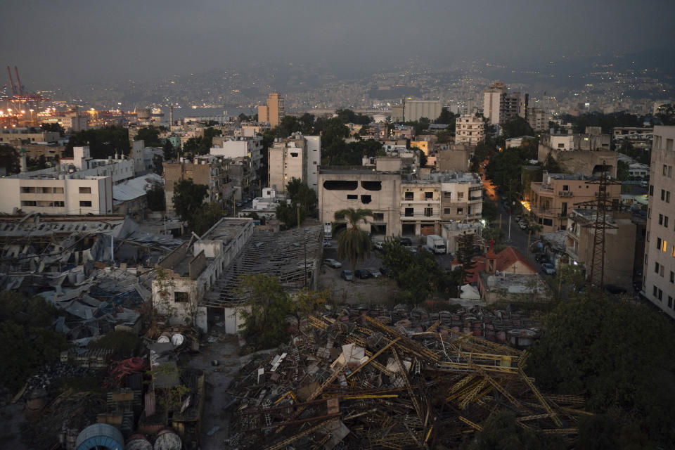 Damaged buildings are seen near the site of last week's massive explosion in the port of Beirut, Lebanon, Friday, Aug. 14, 2020. (AP Photo/Felipe Dana)