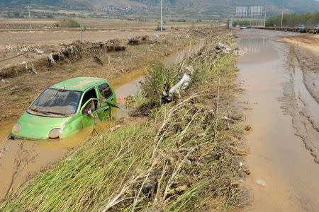 A wrecked car is seen after heavy floods in Cento near Skopje, Macedonia, August 7, 2016. REUTERS/Stringer FOR EDITORIAL USE ONLY. NO RESEALES. NO ARCHIVE