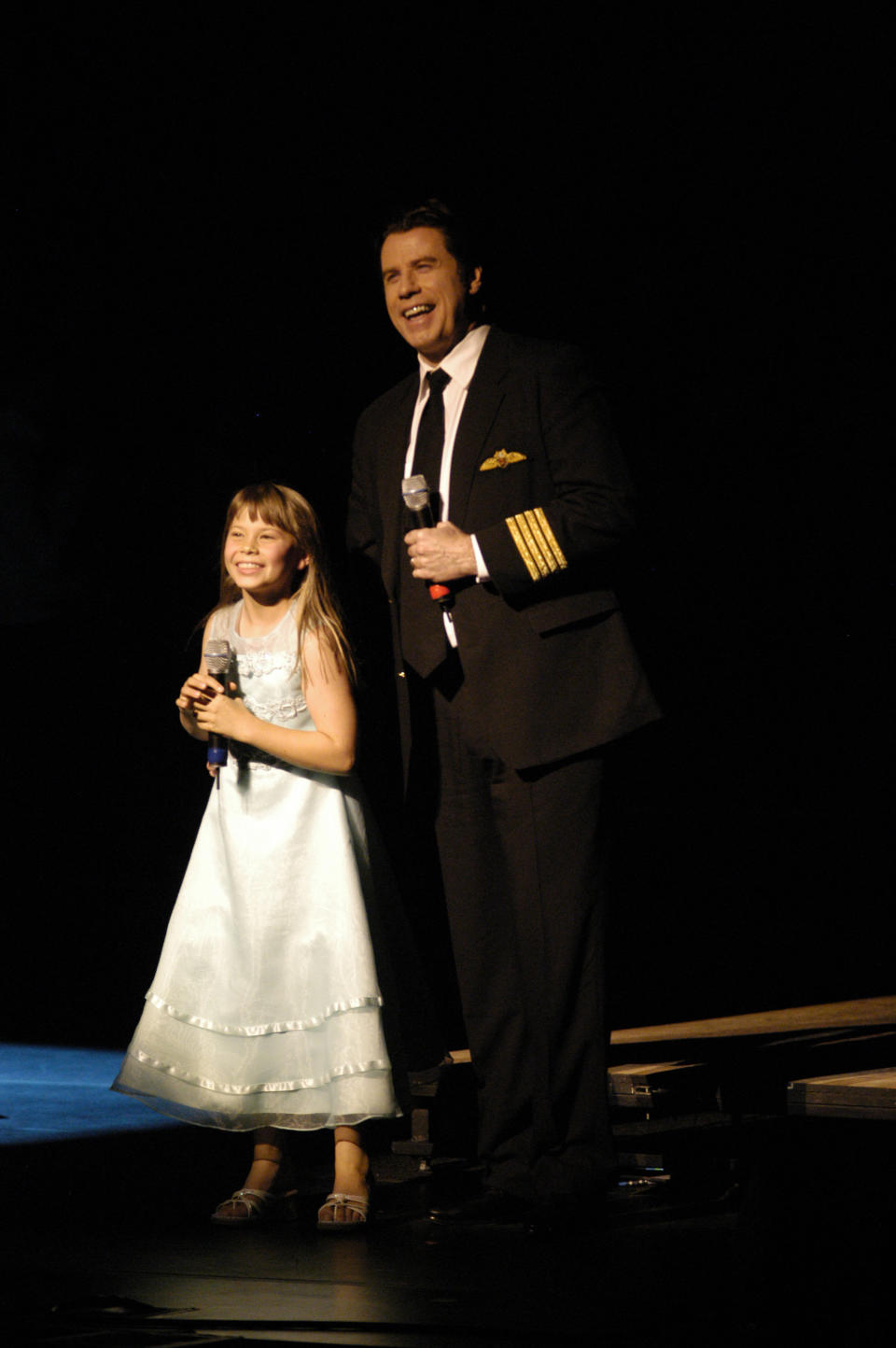 Actor John Travolta and Bindi Irwin stand on stage for Austrailia Plays Broadway during the opening night celebration for G'DAY USA: Australia Week at Jazz Lincoln Center January 22, 2008 in New York City. (Photo by Steven Henry/Getty Images)