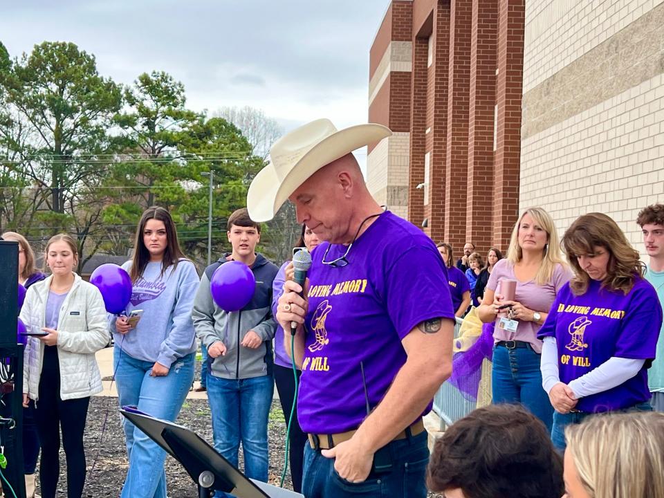 Central High School Principal Dr. Michael Steele dons a cowboy hat and purple shirt, which was Will Spiess' trademark look and favorite color.