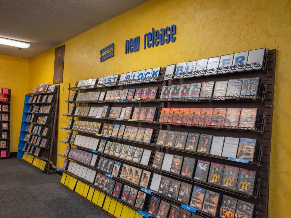 blockbuster yellow wall with new releases and videos on shelves