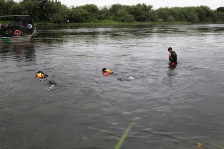 U.S. Border Patrol agents search for a missing 2-year-old in the Rio Grande River near Del Rio Texas