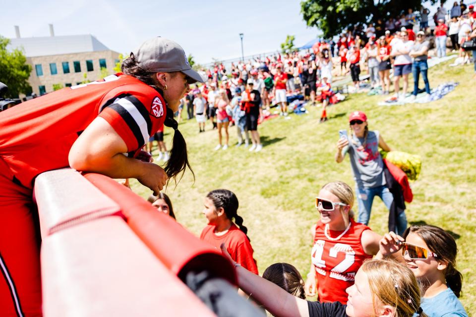 Utah infielder Julia Jimenez (42) celebrates with fans after winning the NCAA softball Super Regional between Utah and San Diego State at Dumke Family Softball Stadium in Salt Lake City on Sunday, May 28, 2023. | Ryan Sun, Deseret News