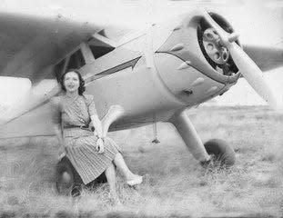 Jimmie Kolp with a Cessna, one of nine airplanes she kept at her airport near Electra.