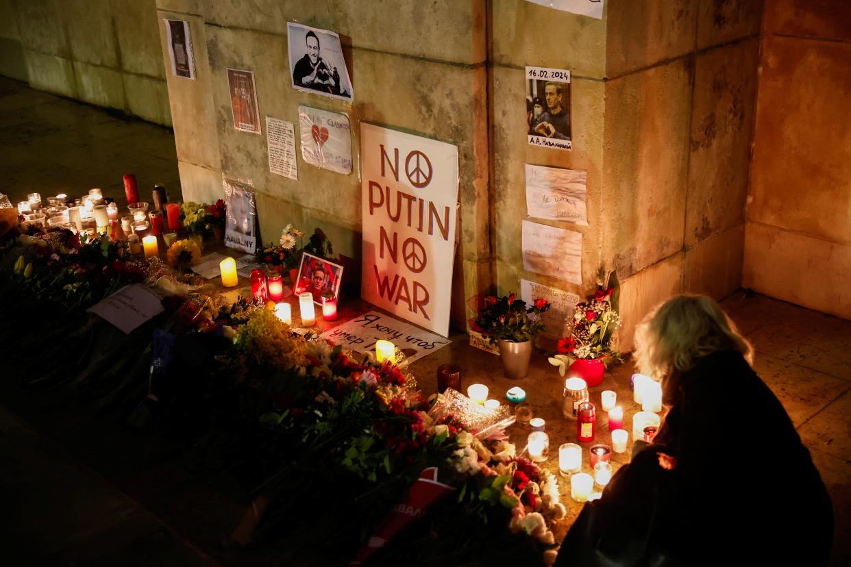 People attend a vigil following the death of Russian opposition leader Alexei Navalny, in Paris (Reuters)
