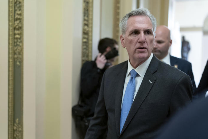 Speaker of the House Kevin McCarthy, R-Calif., talks to reporters as he walks to the speaker's ceremonial office at the Capitol in Washington, Monday, Jan. 9, 2023. (AP Photo/Jose Luis Magana)