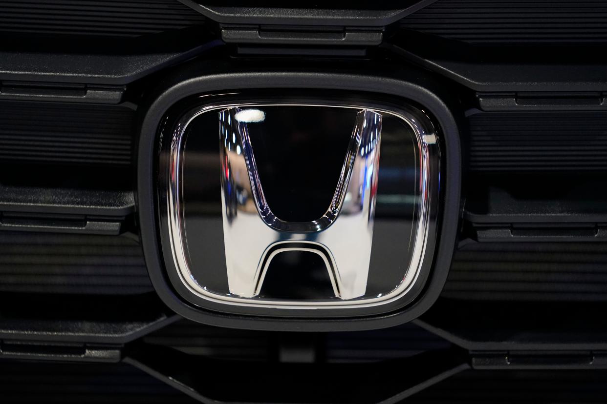 A Honda logo shines at the Philadelphia Auto Show on Jan. 27, 2023.
