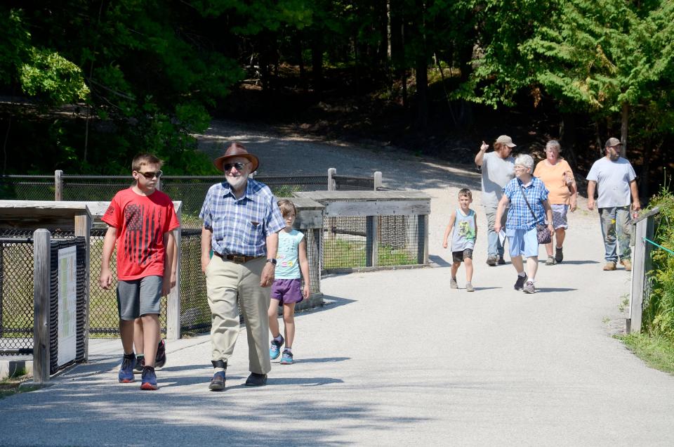 People walk through the Oden State Fish Hatchery on Thursday, Aug. 3, 2023 during an open house event.