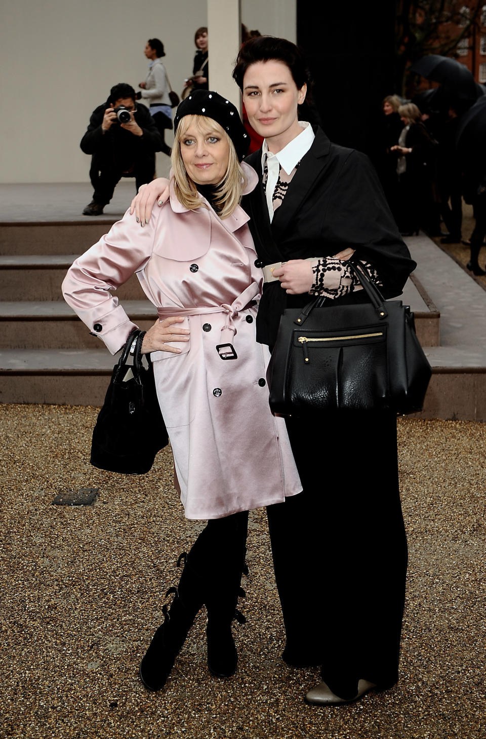 Models Twiggy and Erin O'Connor attend the Burberry Prorsum fall/winter 2010 womenswear show at the Parade Ground at Chelsea College of Art in London.