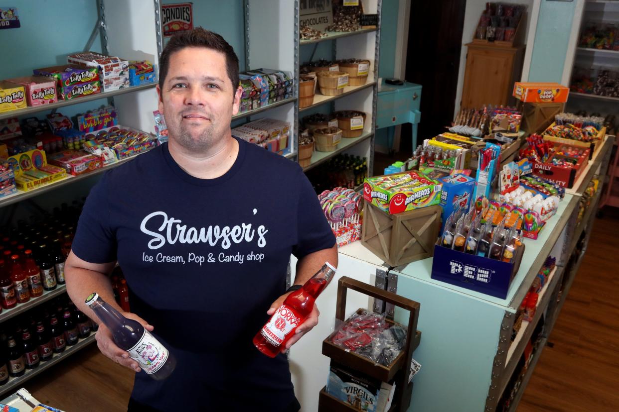 Strawser's Ice Cream, Pop & Candy shop co-owner Mike Strawser is shown June 30 inside the store he and his wife, Julie, own. The store is an extension of their What the Float food truck and is a combination ice cream parlor, candy shop and craft-soda store at 4026 Broadway.