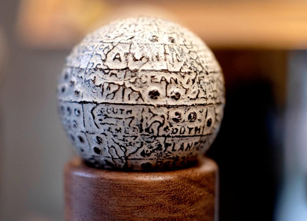 This Gutta-Percha ball made from the rubber sap of Gutta tree in 1902 features a world map at the Old Golf Shop on Worth Avenue January 26, 2024 in Palm Beach.