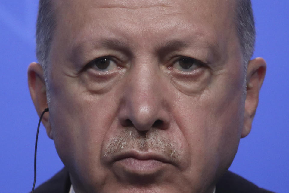 Turkey's President Recep Tayyip Erdogan listens to questions during a media conference at a NATO summit in Brussels, Monday, June 14, 2021. U.S. President Joe Biden is taking part in his first NATO summit, where the 30-nation alliance hopes to reaffirm its unity and discuss increasingly tense relations with China and Russia, as the organization pulls its troops out after 18 years in Afghanistan. (Yves Herman, Pool via AP)