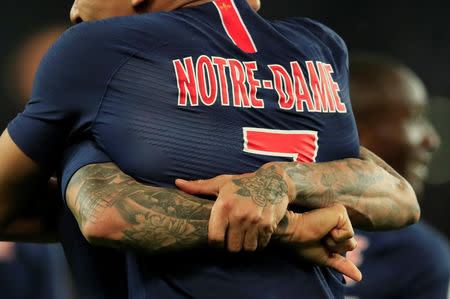 Soccer Football - Ligue 1 - Paris St Germain v AS Monaco - Parc des Princes, Paris, France - April 21, 2019 Paris St Germain's Kylian Mbappe celebrates scoring their third goal and completing his hat-trick with Dani Alves REUTERS/Gonzalo Fuentes