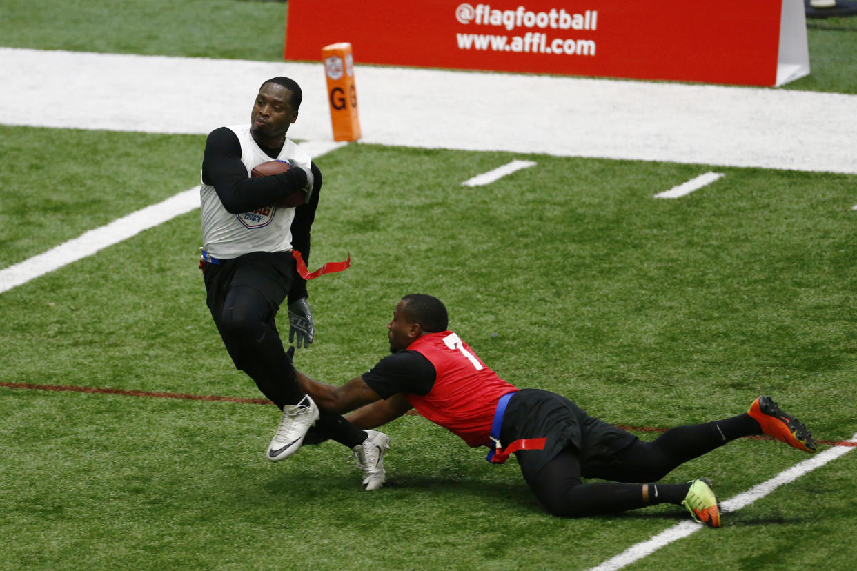 Dream Team's James Calhoun catches a pass for a touchdown over Church's Money's Jeremy Scott during the American Flag Football League Tournament Saturday, June 15, 2019 in Florham Park, N.J. (Adam Hunger/AP Images for the American Flag Football League)