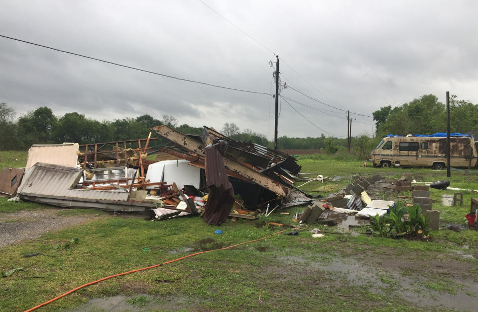 In this photo provided by the St. Martin Parish Sheriff's Office, the remains of a trailer lie where a woman and her 3-year-old daughter were killed during a severe storm, in Breaux Bridge, La., Sunday, April 2, 2017. A tornado flipped the mobile home Sunday in Louisiana, killing the mother and her daughter as a storm system with hurricane-force winds crawled across the Deep South, damaging homes and businesses. (Maj. Ginny Higgins/St. Martin Parish Sheriff's Office via AP)