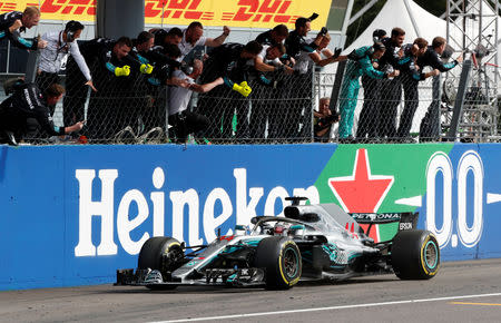 Formula One F1 - Italian Grand Prix - Circuit of Monza, Monza, Italy - September 2, 2018 Mercedes' Lewis Hamilton wins the race as Mercedes team staff celebrate REUTERS/Stefano Rellandini