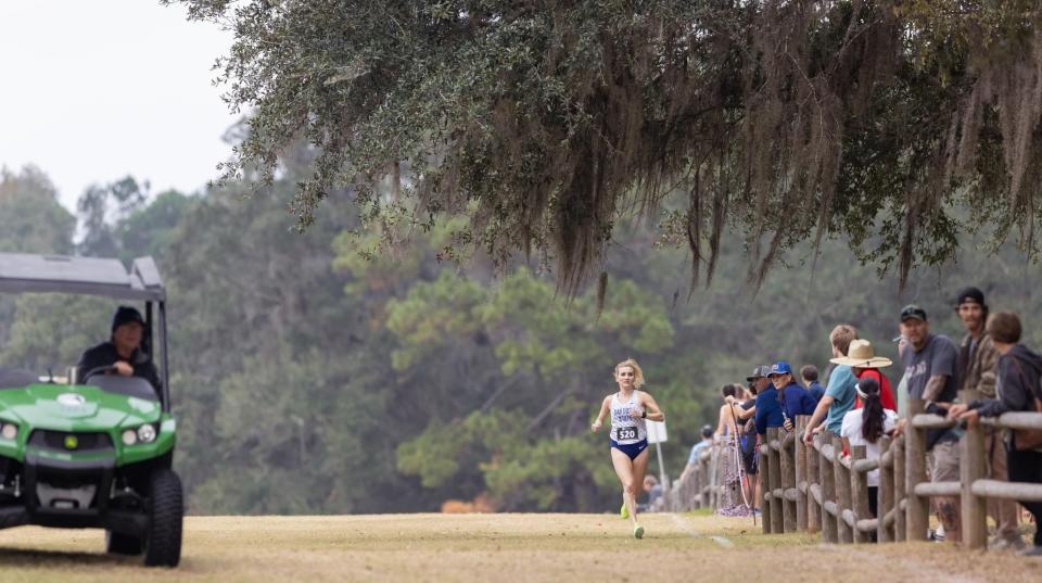 Shannon Jones running well in front of the competition during a cross country run for Daytona State College.