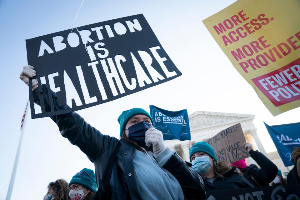 Demonstrators rally outside the Supreme Court ahead of arguments in Dobbs v. Jackson Women's Health Organization, challenging a Mississippi abortion law that would ban elective abortions after 15 weeks.