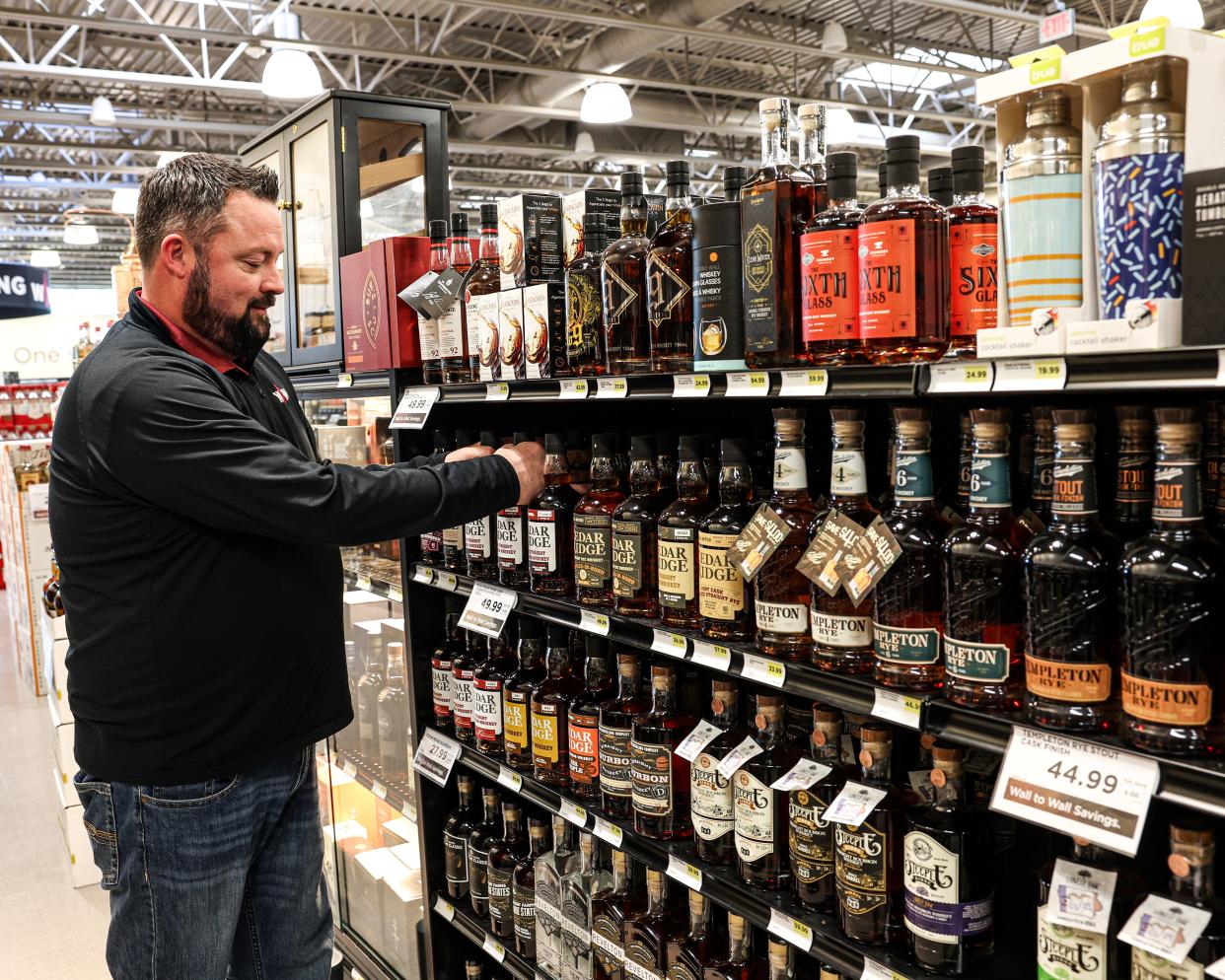 Ryan Metheny, the general manager at Wall to Wall Wine & Spirits in West Des Moines, has one section of the store dedicated to Iowa whiskeys.