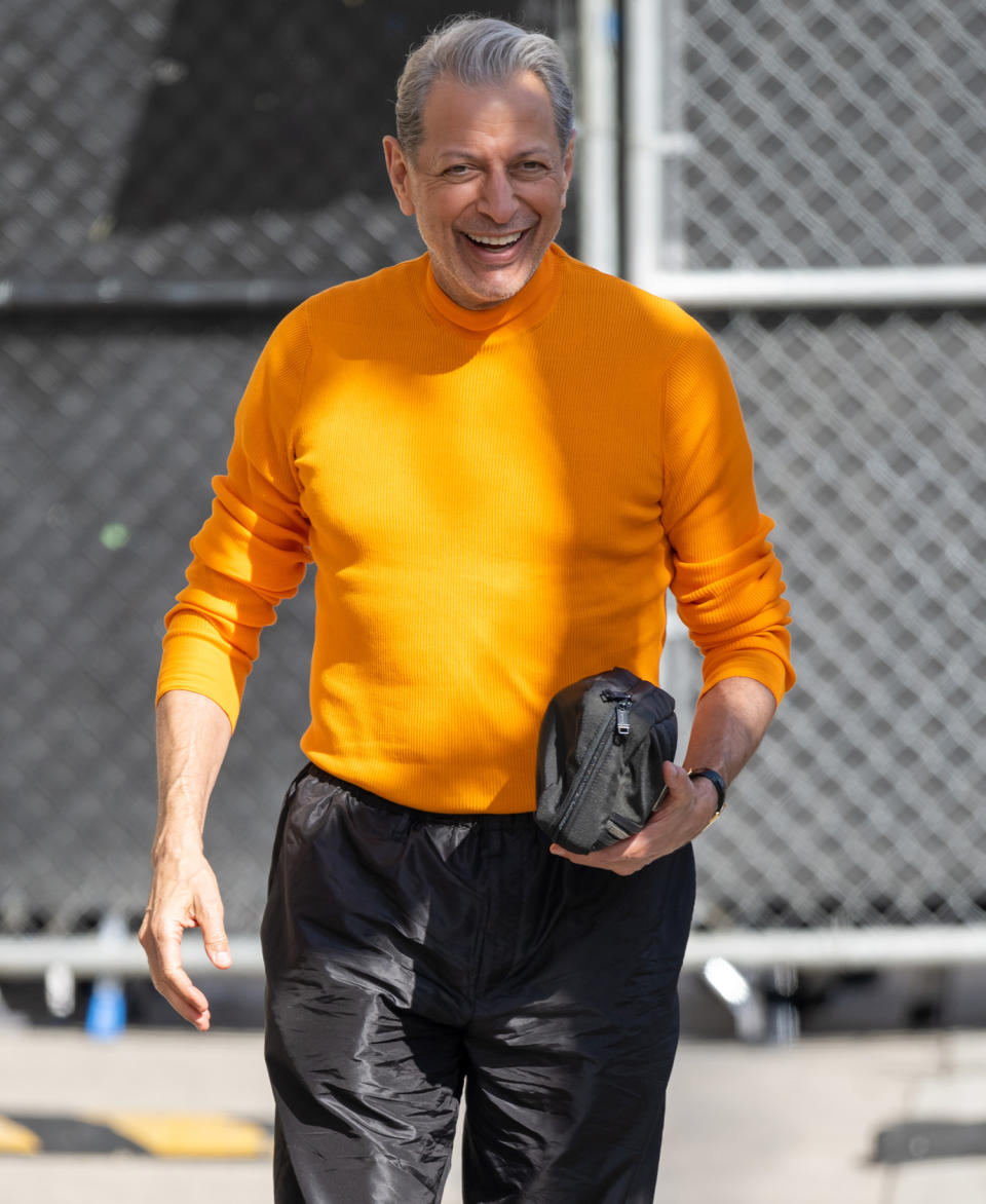 <p><a href="https://people.com/tag/jeff-goldblum/" rel="nofollow noopener" target="_blank" data-ylk="slk:Jeff Goldblum;elm:context_link;itc:0;sec:content-canvas" class="link ">Jeff Goldblum</a> glows in orange at <em>Jimmy Kimmel Live!</em> in Los Angeles on March 23.</p>