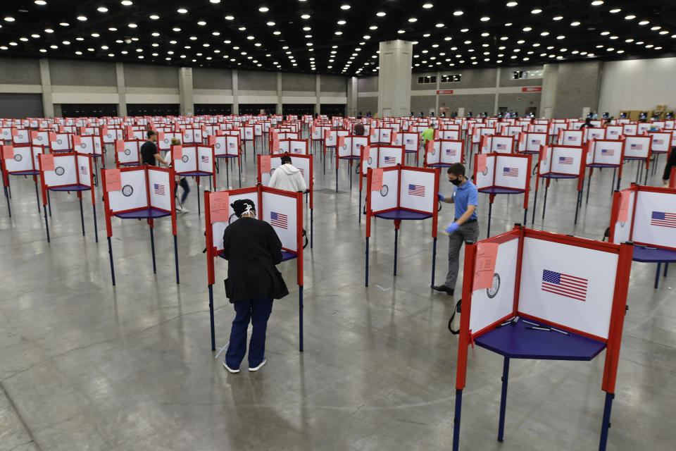 Voting stations are set up in the South Wing of the Kentucky Exposition Center for voters to cast their ballot in the Kentucky primary in Louisville, Ky., Tuesday, June 23, 2020. In an attempt to prevent the spread of the coronavirus, neighborhood precincts were closed and voters that didn't cast mail in ballots were directed to one central polling location. (AP Photo/Timothy D. Easley)