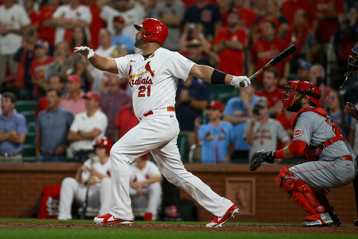 ST. LOUIS, MO - SEPTEMBER 15: Albert Pujols #5 of the St. Louis Cardinals follows through on a sacrifice fly during the ninth inning against the Cincinnati Reds at Busch Stadium on September 15, 2022 in St. Louis, Missouri. Select players are wearing the number 21 in honor of Roberto Clemente Day. (Photo by Scott Kane/Getty Images)