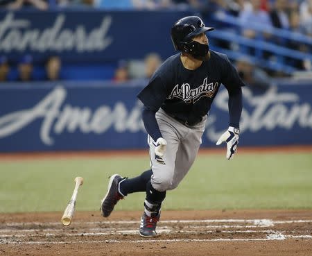 Jun 19, 2018; Toronto, Ontario, CAN; Atlanta Braves center fielder Ender Inciarte (11) hits a two run double during the fifth inning against the Toronto Blue Jays at Rogers Centre. Mandatory Credit: John E. Sokolowski-USA TODAY Sports