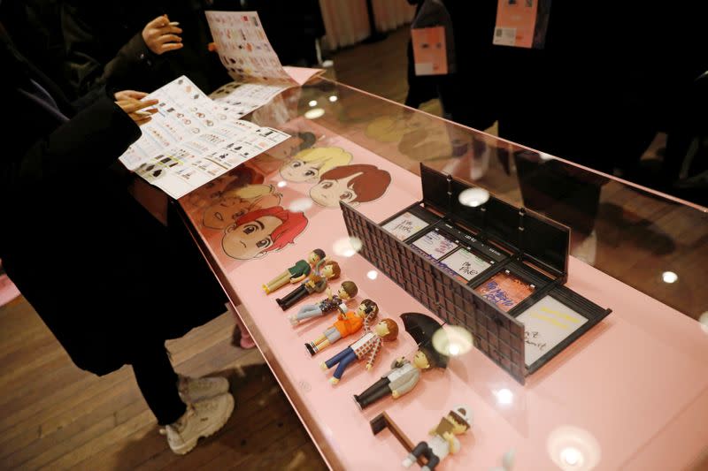 Fans of K-pop idol boy band BTS shop at a pop-up store selling BTS goods in Seoul