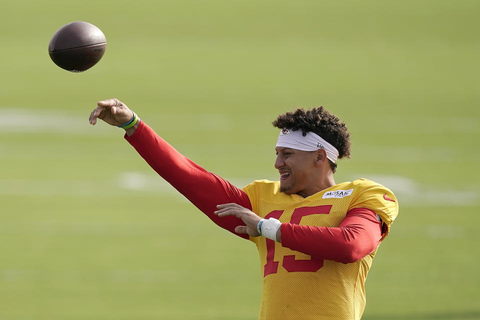 Kansas City Chiefs quarterback Patrick Mahomes passes during NFL football training camp Sunday, Aug. 7, 2022, in St. Joseph, Mo. (AP Photo/Charlie Riedel)