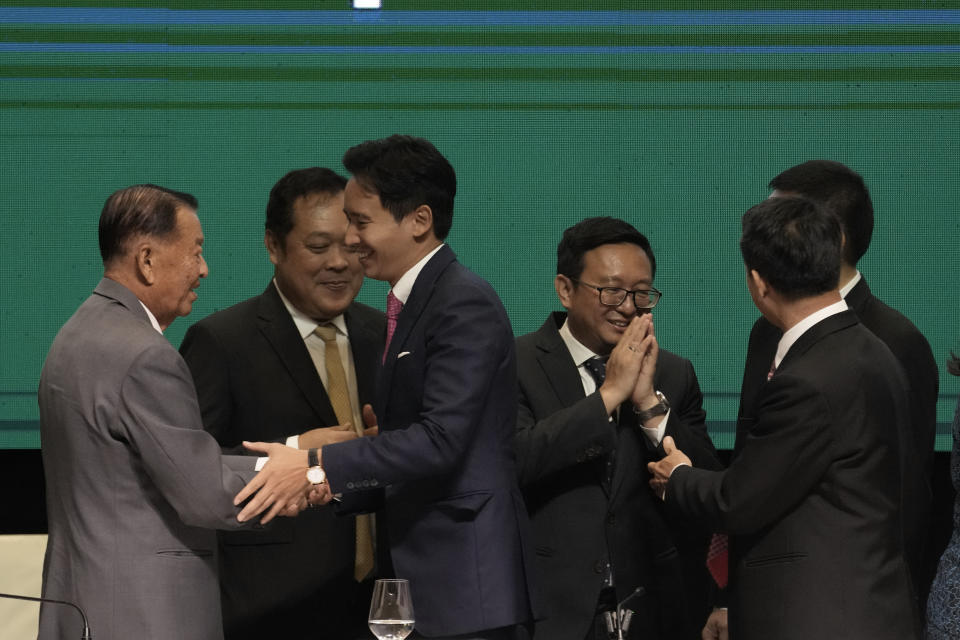 Leader Prachachat party Wan Muhamad Noor Matha, left, shakes hands with Leader of Move Forward Party Pita Limjaroenrat after signing a memorandum of understanding on attempt to form a coalition government between Move Forward Party and other parties during a news conference in Bangkok, Thailand, Monday, May 22, 2023. Move Forward won the most seats in the May 14 election, and it has formed a coalition that seeks to become the government when Parliament selects a prime minister in July. (AP Photo/Sakchai Lalit)