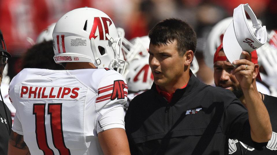 Austin Peay head coach Will Healy speaks to Austin Peay wide receiver DeAngelo Wilson (11) during the first half of an NCAA college football game, Saturday, Sept. 1, 2018, in Athens, Ga. (AP)