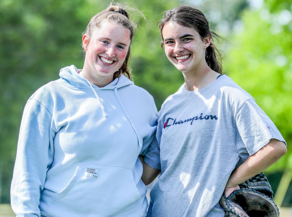Norwell softball pitcher Maggie Donohue stands with catcher Taylor Veneto at practice on Thursday, May 26, 2022. Donohue has thrown five no-hitters in her senior season.