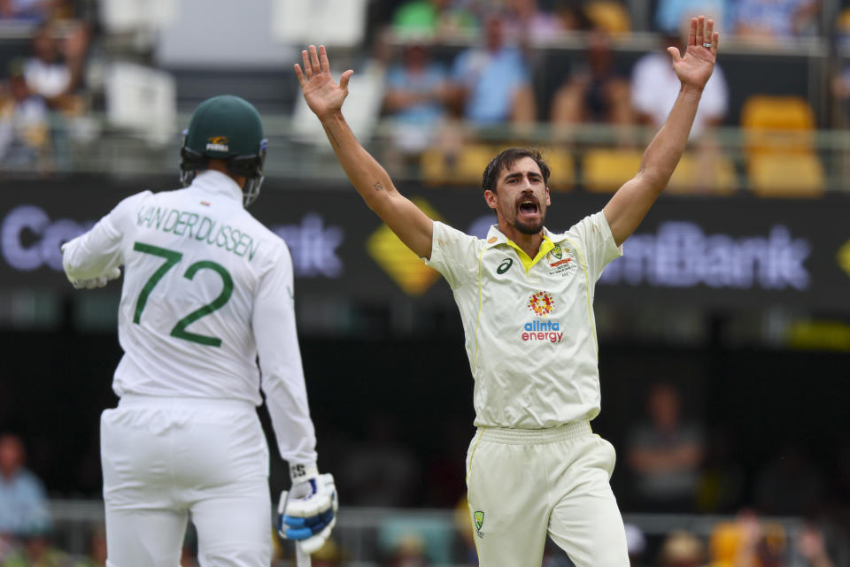 Australia's Mitchell Starc appeals unsuccessfully for a wicket during day two of the first cricket test between South Africa and Australia at the Gabba in Brisbane, Australia, Sunday, Dec.18, 2022. (AP Photo/Tertius Pickard)