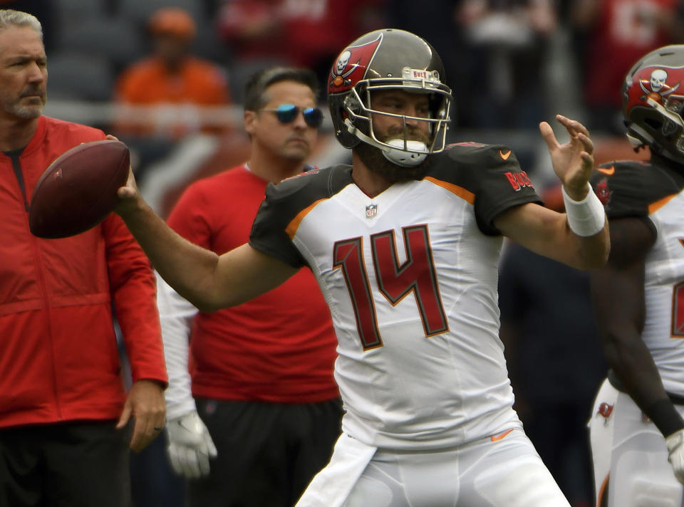 Tampa Bay Buccaneers quarterback Ryan Fitzpatrick (14) warms up before an NFL football game against the Chicago Bears Sunday, Sept. 30, 2018, in Chicago. (AP Photo/David Banks)