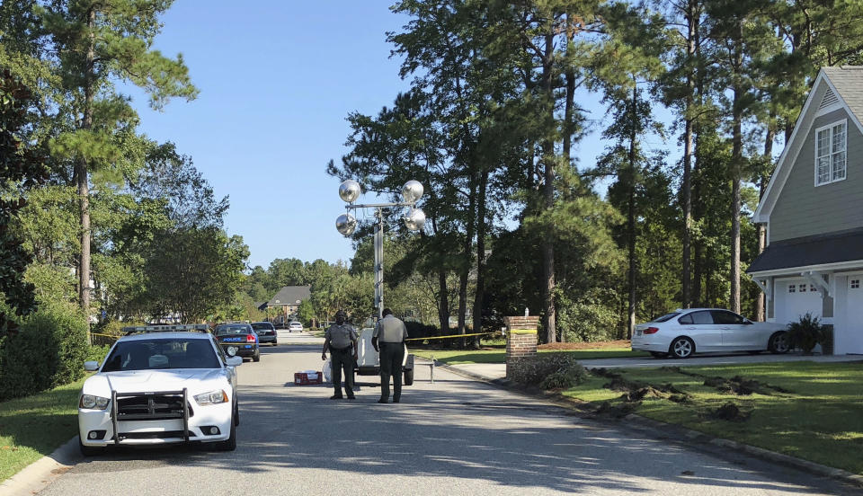 <p> Police patrol the area of a fatal shooting in Florence, S.C., Thursday, Oct. 4, 2018. Frederick Hopkins, a Vietnam veteran who bragged online about maintaining his target-shooting skills was being held in the shooting of multiple law enforcement officers as deputies tried to serve a search warrant at his home Wednesday night. (AP Photo/Jeffrey S. Collins) </p>