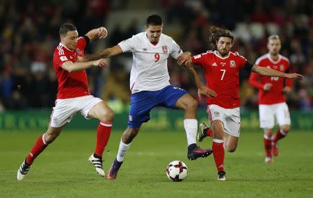 Britain Soccer Football - Wales v Serbia - 2018 World Cup Qualifying European Zone - Group D - Cardiff City Stadium, Cardiff, Wales - 12/11/16 Serbia's Aleksandar Mitrovic in action with Wales' Joe Allen and James Chester Action Images via Reuters / Matthew Childs