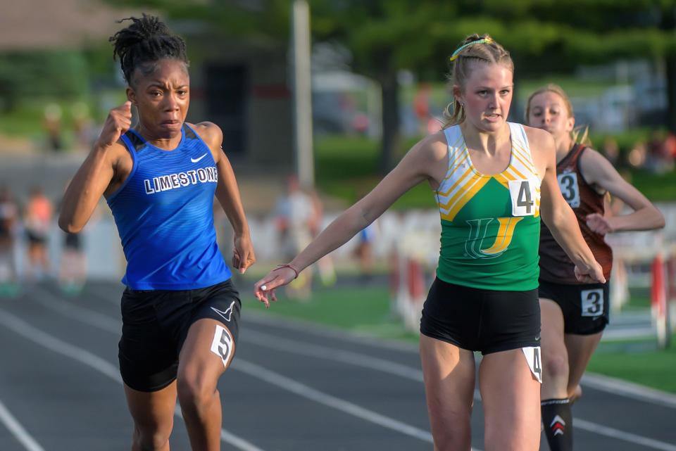 Limestone's Ranaisha Howard-Dunigan, left, edges U-High's Reese Mitchell for a victory in the 100-meter dash during the Class 2A girls sectional track and field meet Wednesday, May 8, 2024 in Metamora.