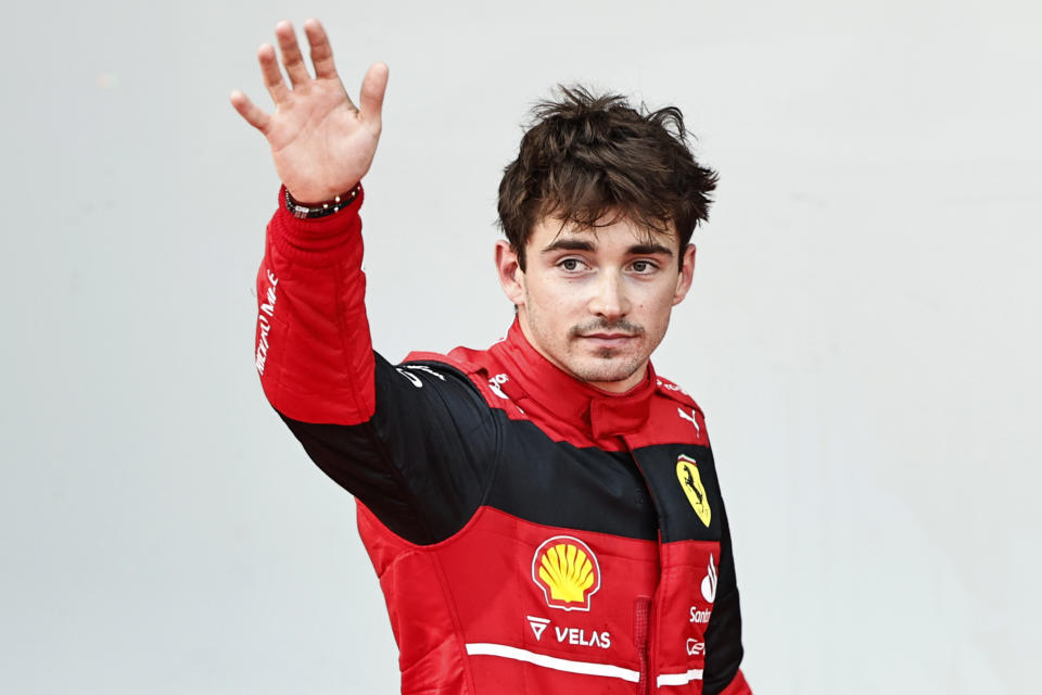 Ferrari driver Charles Leclerc of Monaco celebrates after setting the pole position in the qualifying session at the Baku circuit, in Baku, Azerbaijan, Saturday, June 11, 2022. The Formula One Grand Prix will be held on Sunday. (Hamad Mohammed, Pool Via AP)