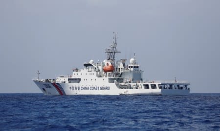 FILE PHOTO: A China Coast Guard vessel patrols at the disputed Scarborough Shoal