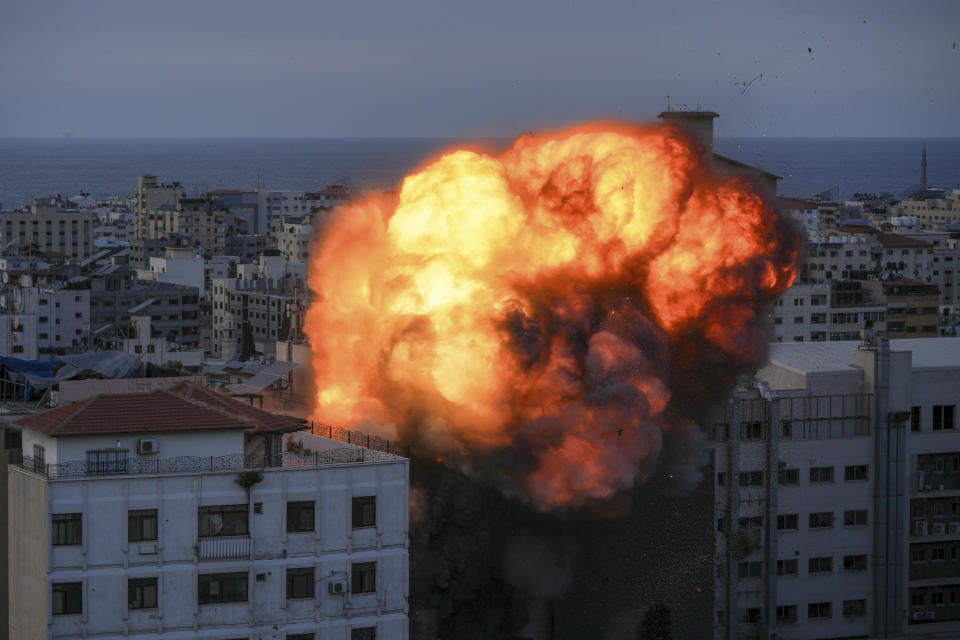 Fire and smoke rise following an Israeli airstrike, in Gaza City, Sunday, Oct. 8, 2023. The militant Hamas rulers of the Gaza Strip carried out an unprecedented, multi-front attack on Israel at daybreak Saturday, firing thousands of rockets as dozens of Hamas fighters infiltrated the heavily fortified border in several locations, killing hundreds and taking captives. Palestinian health officials reported scores of deaths from Israeli airstrikes in Gaza. (AP Photo/Hatem Moussa)