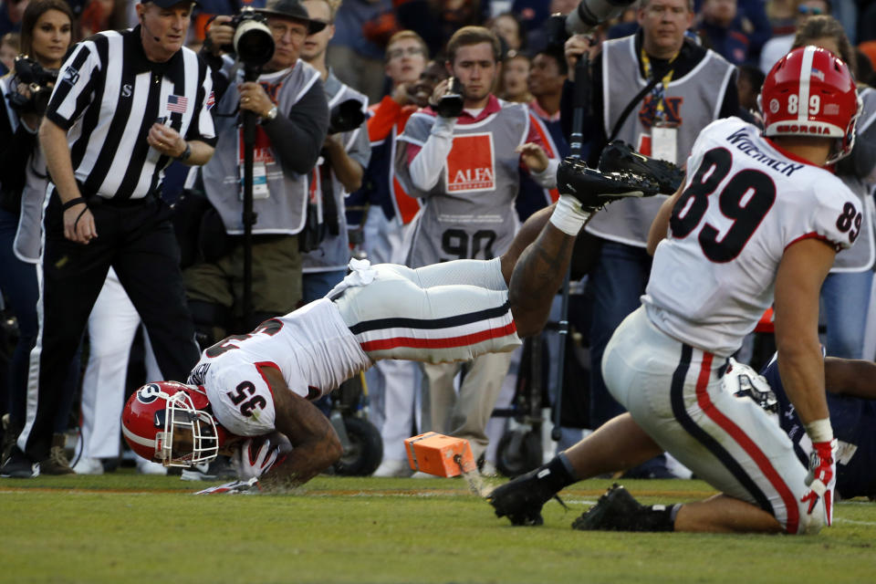 Georgia running back Brian Herrien (35) dives into the end zone for a touchdown during the first half of an NCAA college football game against Auburn, Saturday, Nov. 16, 2019, in Auburn, Ala. (AP Photo/Butch Dill)