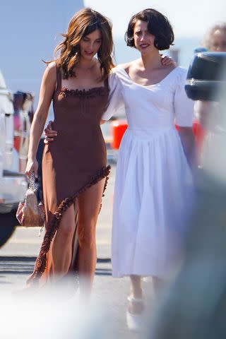 <p>The Image Direct</p> Margaret Qualley and sister Rainey Qualley attend the couple's rehearsal dinner.