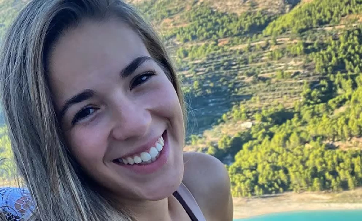 Marta Pérez smiling in front of a mountain before she severed an allergic reaction.