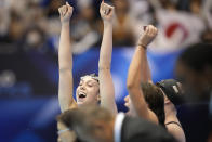 Gretchen Walsh of the U.S. celebrates with her team mates after winning the women's 4x100m medley relay final at the World Swimming Championships in Fukuoka, Japan, Sunday, July 30, 2023. (AP Photo/Eugene Hoshiko)