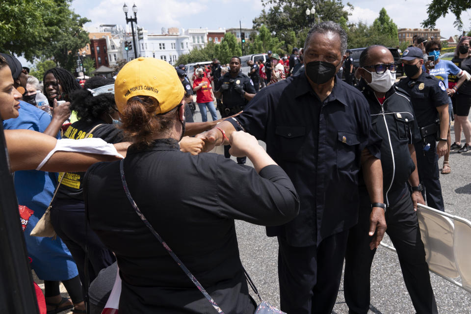 Rev. Jesse Jackson shake hands with supporters as they protest outside of the Hart Senate Office Building, during demonstration supporting the voting rights, on Capitol Hill, in Washington, Monday, Aug. 2, 2021. (AP Photo/Jose Luis Magana)