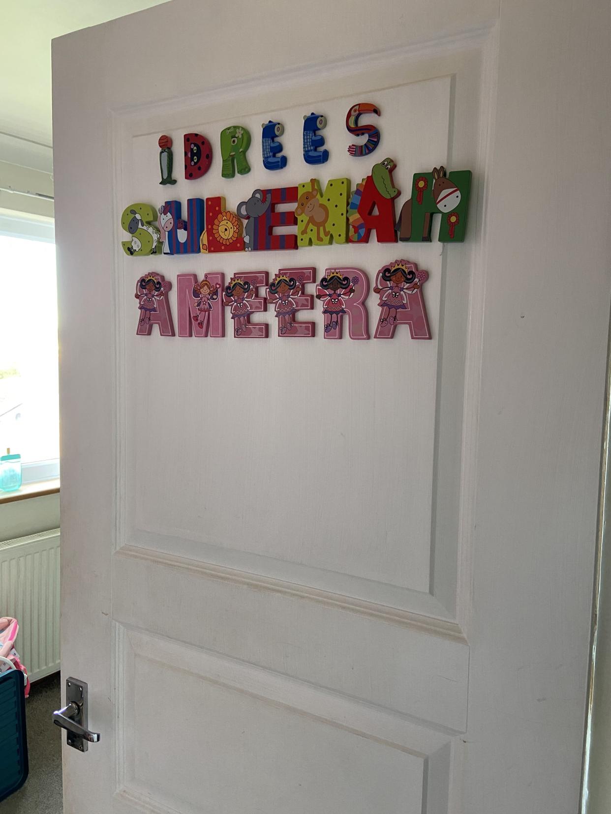 A door with the names of Sanam Saleh's three children - Idrees, Suleman and Ameera