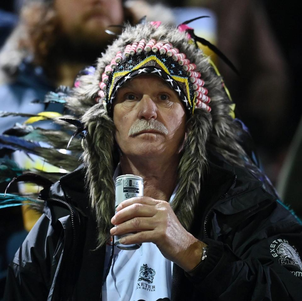 An Exeter Chiefs fan wears a headdress during the Gallagher Premiership Rugby match between Bath Rugby and Exeter Chiefs at The Recreation Ground on November 26, 2021 in Bath, England. - GETTY IMAGES